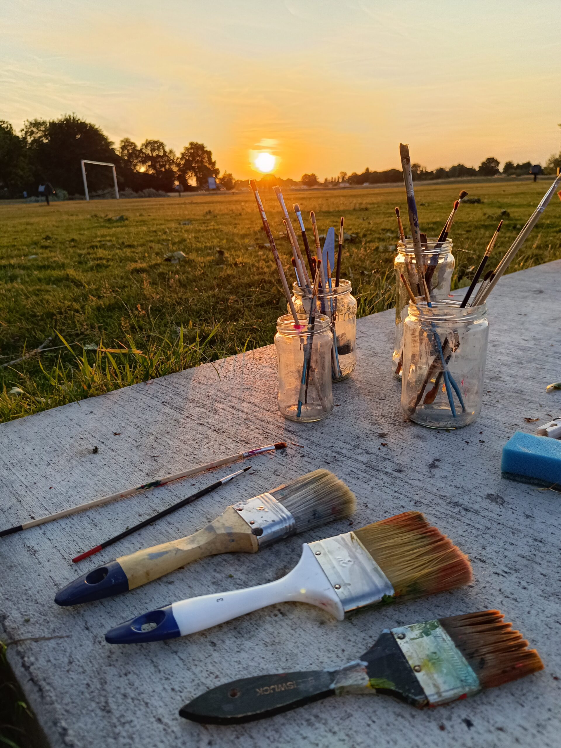 Kwasten bij zonsondergang